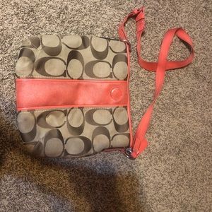 Coach sling. Coral/orangish. Normal wear.